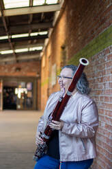 Cassandra Bendickson and bassoon, photo by Mindi Rey Acosta, FluteloopPhotography